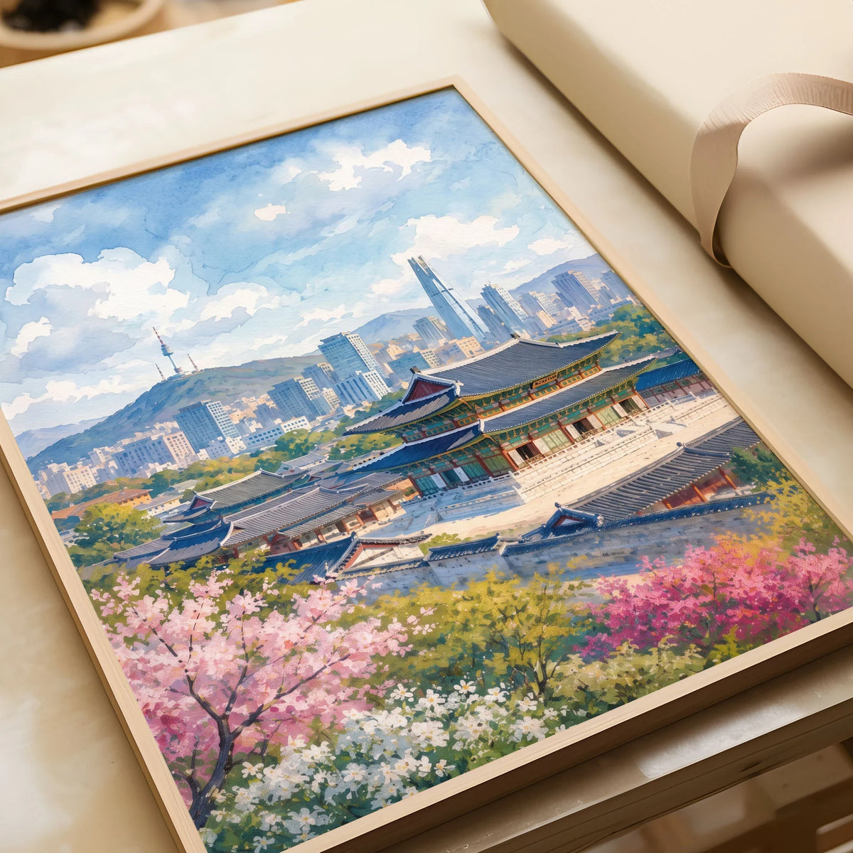 Seoul Gyeongbokgung Palace and skyline watercolour art print in a natural wood frame, gift close-up