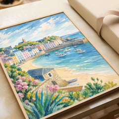 Tenby pastel harbour houses and beach watercolour art print in a natural wood frame, gift close-up