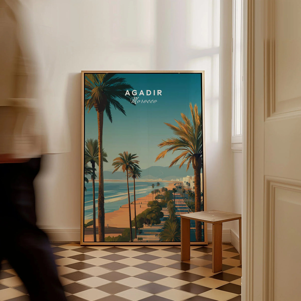 Agadir Travel Poster Print Morocco - Palm Trees as a framed canvas leaning in a hallway with a chequered tiled floor
