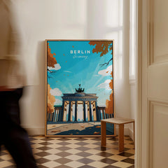 Berlin Poster Blue Sky as a framed canvas leaning in a hallway with a chequered tiled floor