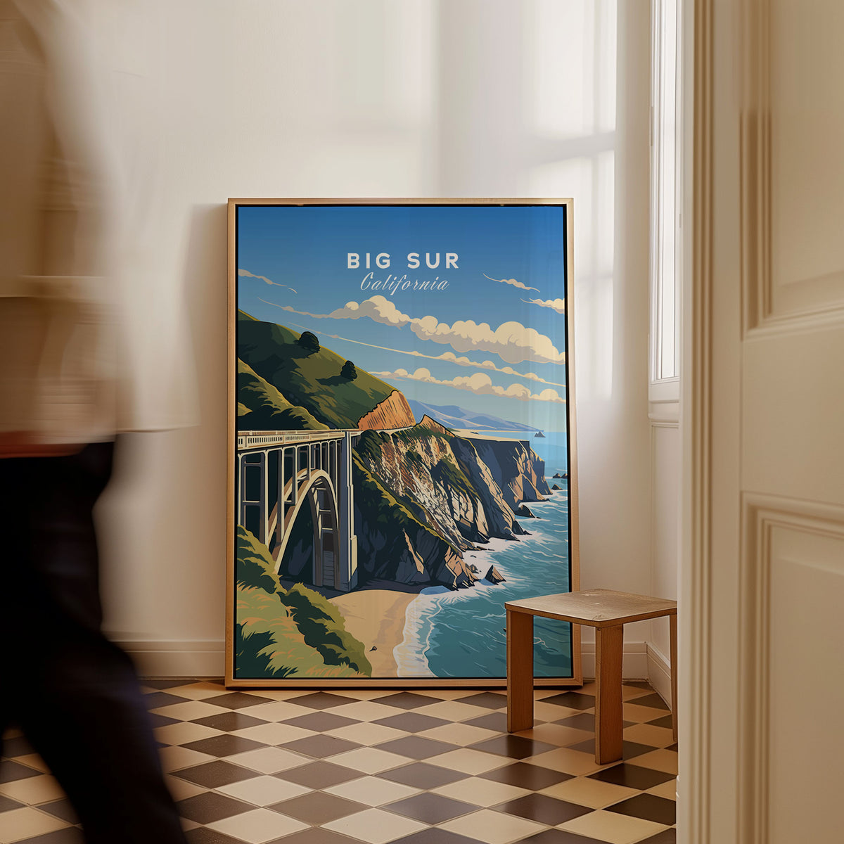 Big Sur Print as a framed canvas leaning in a hallway with a chequered tiled floor