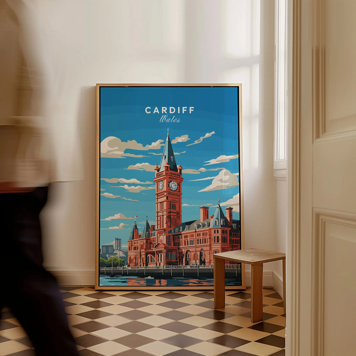 Cardiff Travel Poster as a framed canvas leaning in a hallway with a chequered tiled floor