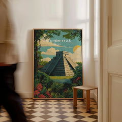 Chichén Itzá Mexico Travel Poster Pyramid Jungle Print Mayan Ruins Wall Art Decor as a framed canvas leaning in a hallway with a chequered tiled floor