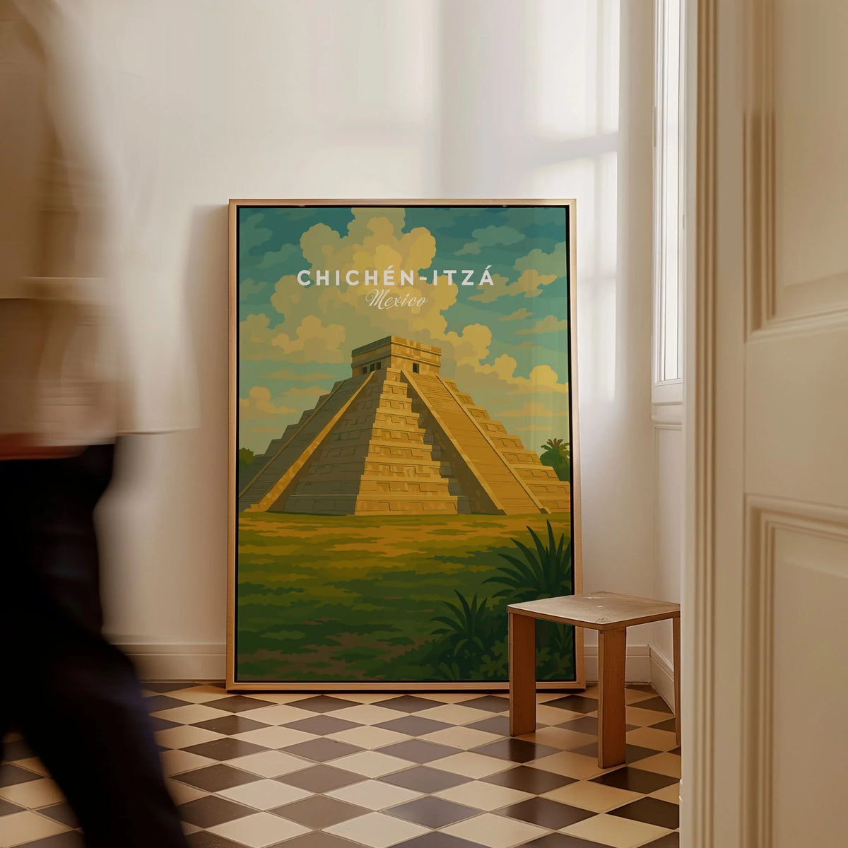 Chichén Itzá Mexico El Castillo Pyramid Travel Print Mayan Landscape Poster Wall Art as a framed canvas leaning in a hallway with a chequered tiled floor
