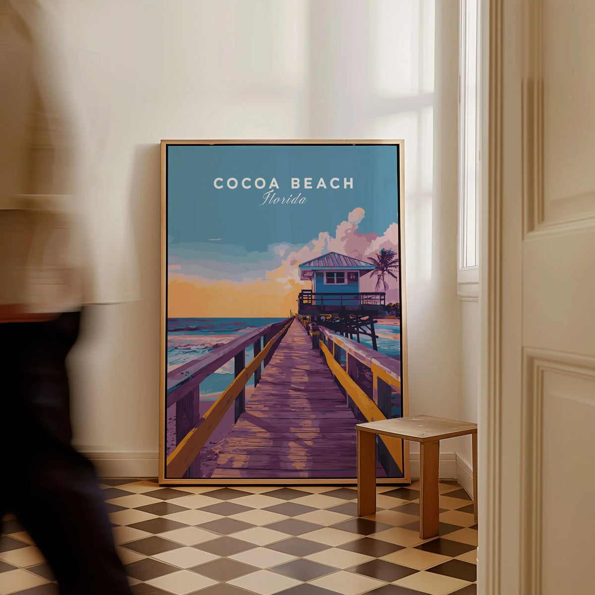 Cocoa Beach Boardwalk Print - Florida Sunset Wall Art as a framed canvas leaning in a hallway with a chequered tiled floor