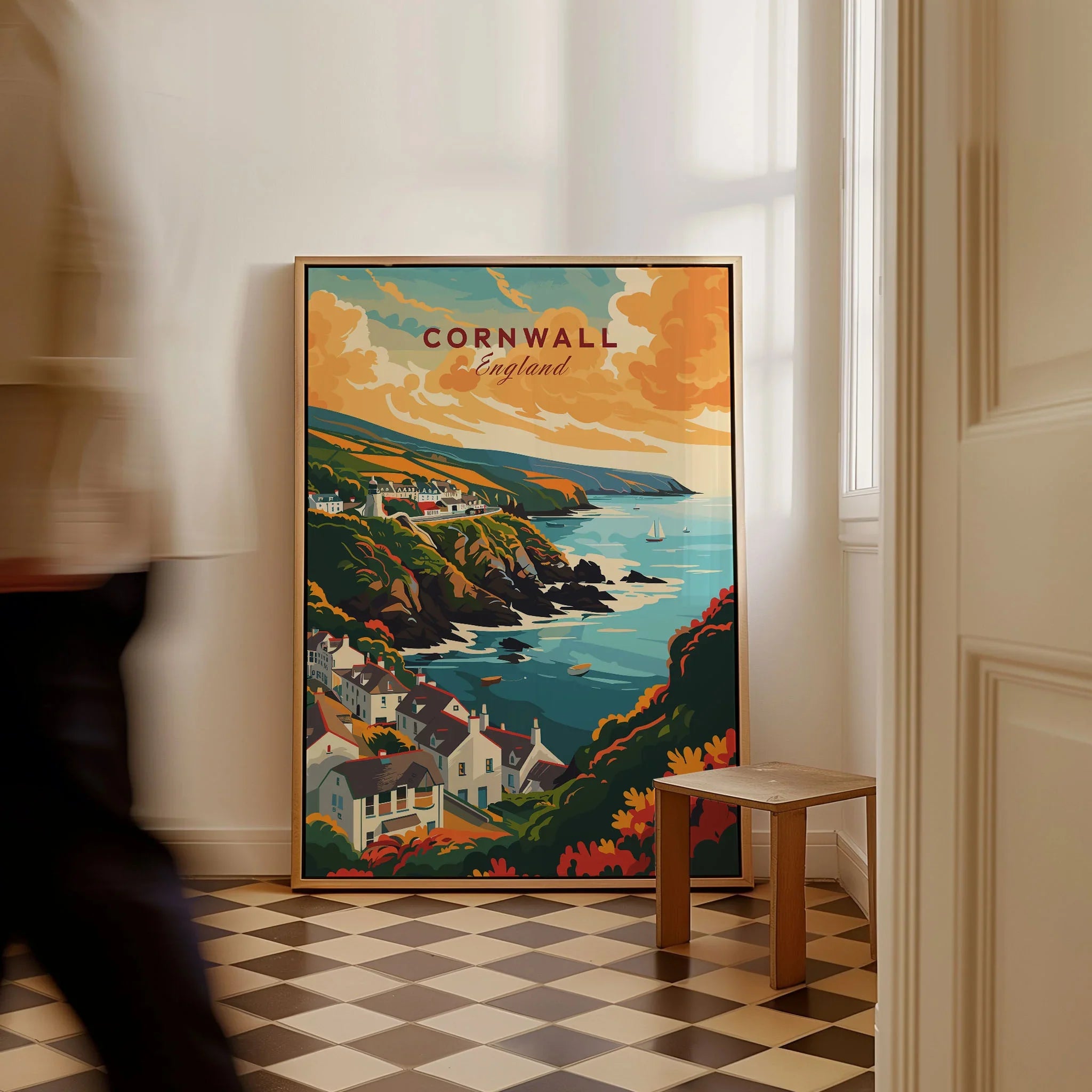 Cornwall Travel Print as a framed canvas leaning in a hallway with a chequered tiled floor
