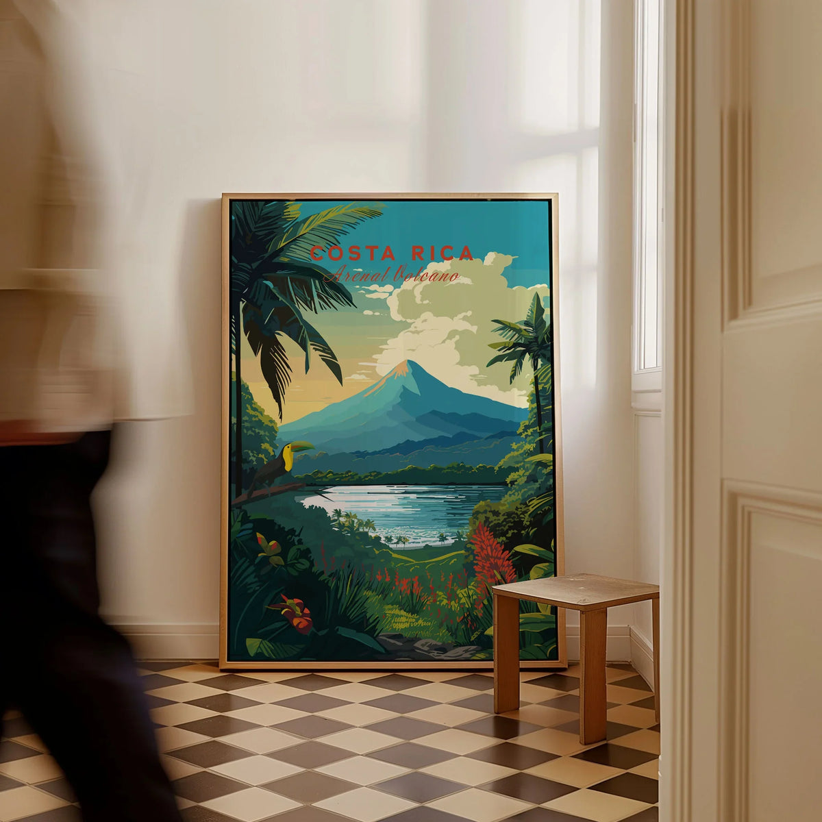 Costa Rica Print as a framed canvas leaning in a hallway with a chequered tiled floor