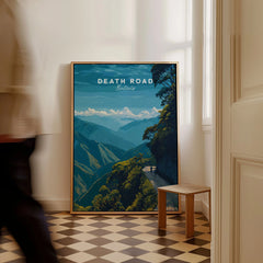 Death Road Yungas Adventure Scenic Print | Bolivian Travel Wall Decor as a framed canvas leaning in a hallway with a chequered tiled floor