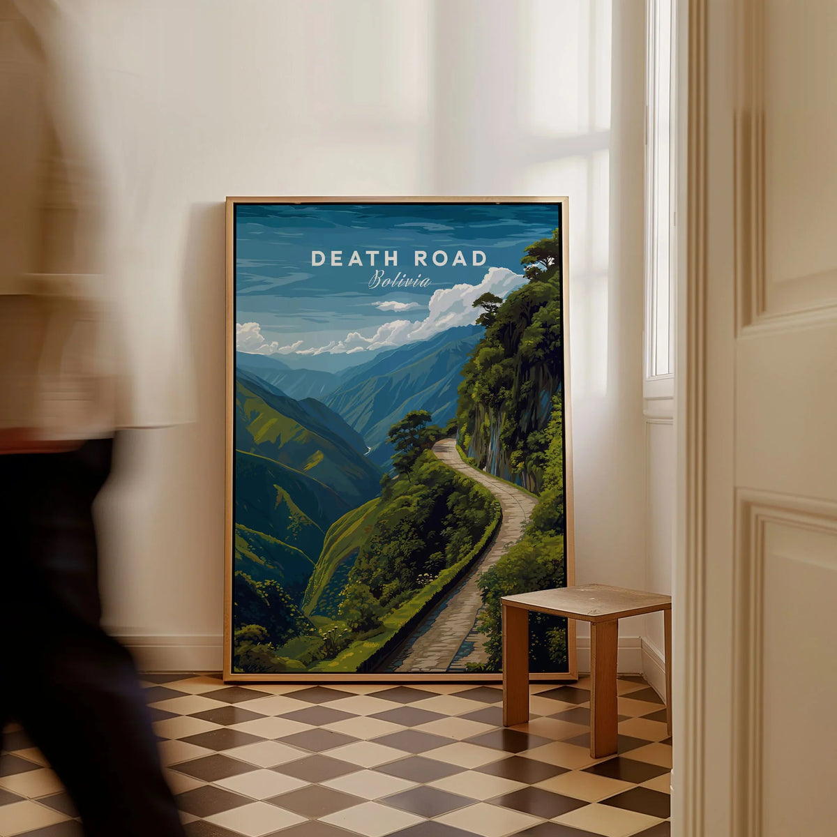 Death Road Andes Print | Yungas Road Poster as a framed canvas leaning in a hallway with a chequered tiled floor