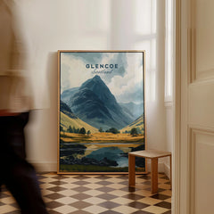 Glencoe Travel Print as a framed canvas leaning in a hallway with a chequered tiled floor