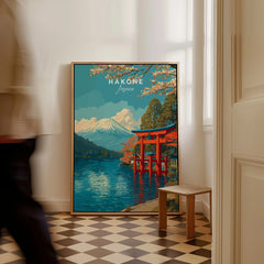HakonePrint Japan Peace Shrine Torii Artwork - Mount Fuji Lake Ashi Poster as a framed canvas leaning in a hallway with a chequered tiled floor