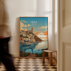 Ibiza Poster Print as a framed canvas leaning in a hallway with a chequered tiled floor