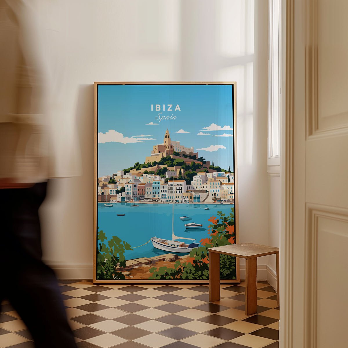 Ibiza Print as a framed canvas leaning in a hallway with a chequered tiled floor
