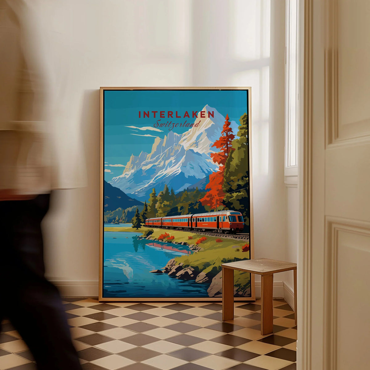 Interlaken Print Switzerland as a framed canvas leaning in a hallway with a chequered tiled floor