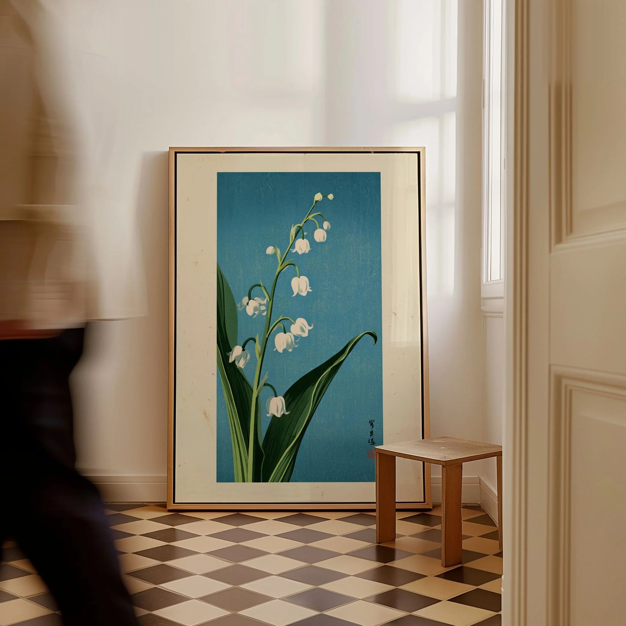 Lily of the Valley Art Print – Blue Japanese Botanical Wall Art — framed canvas on floor man walking past