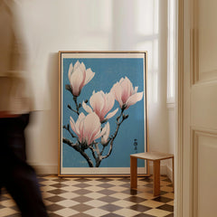 Pink Magnolia Art Print – Blue Japanese Botanical Wall Art — framed canvas on floor man walking past