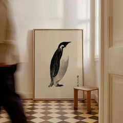 Emperor Penguin Wall Art – Vintage Japanese Ink Print — framed canvas on floor man walking past