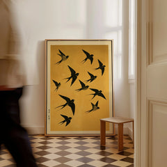 Flying Swallows Wall Art – Vintage Japanese Gold Print — framed canvas on floor man walking past