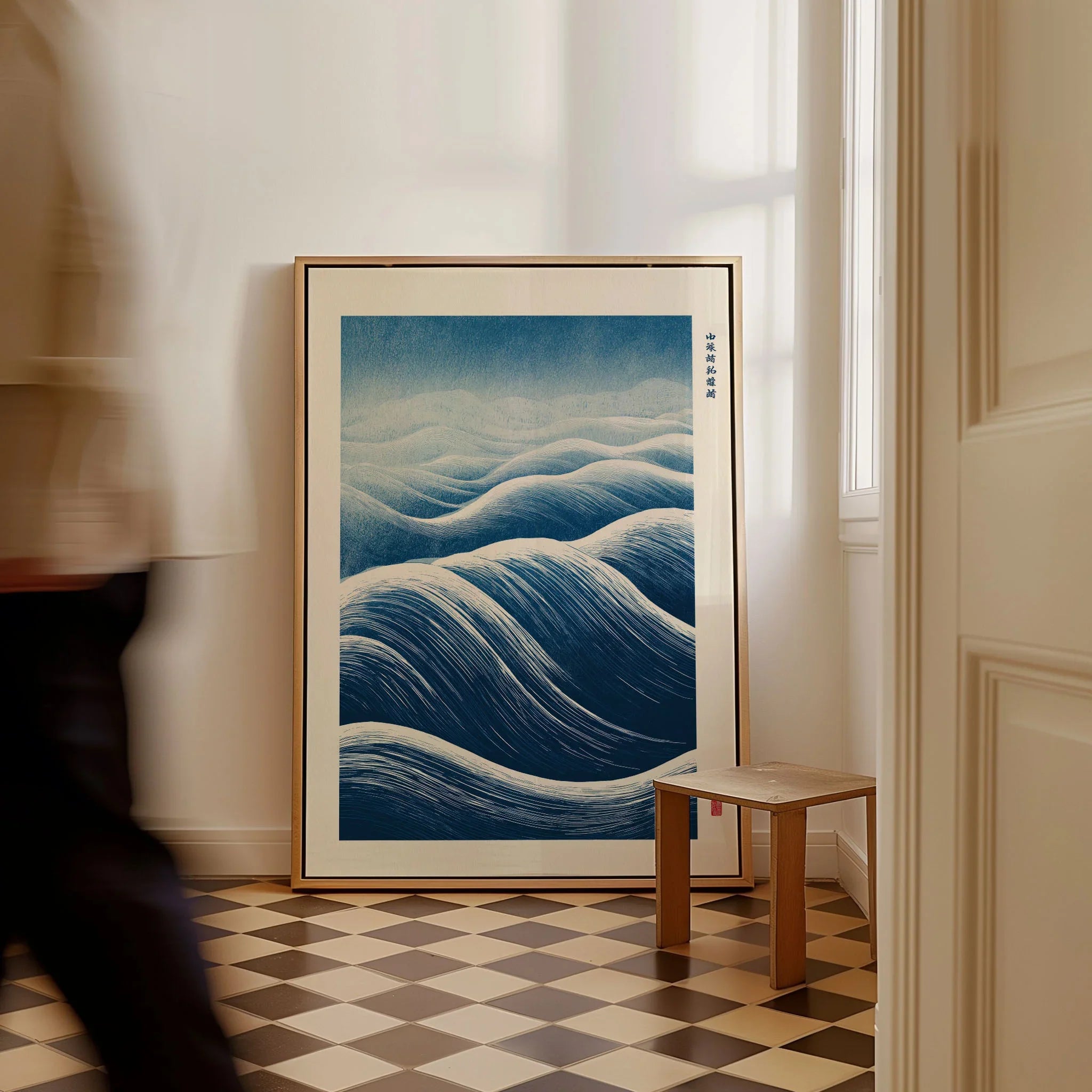 Ocean Wave Art Print – Blue Japanese Woodblock Wall Art — framed canvas on floor man walking past