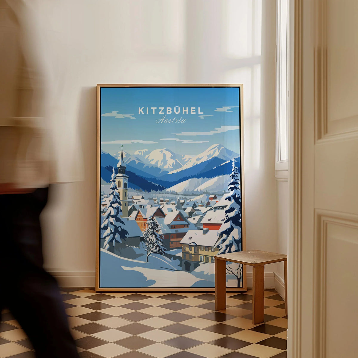 Kitzbuhel Poster as a framed canvas leaning in a hallway with a chequered tiled floor