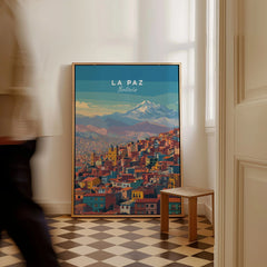La Paz Bolivia Andes Mountain City Print - Travel Poster as a framed canvas leaning in a hallway with a chequered tiled floor