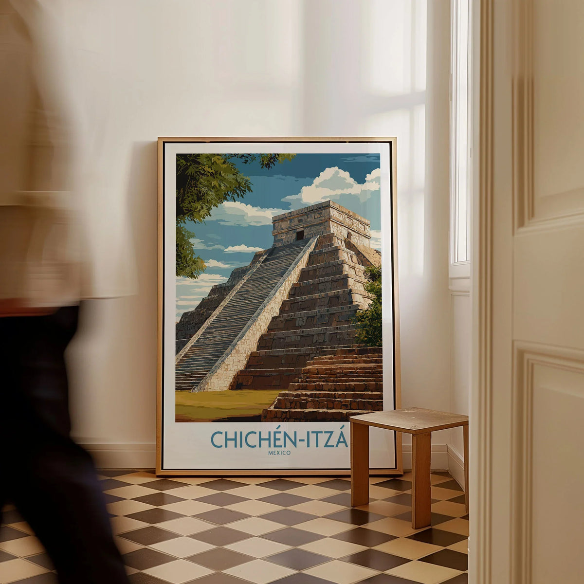Mexico Chichén Itzá El Castillo Poster Mayan Temple Travel Print Ancient Ruins Wall Art as a framed canvas leaning in a hallway with a chequered tiled floor