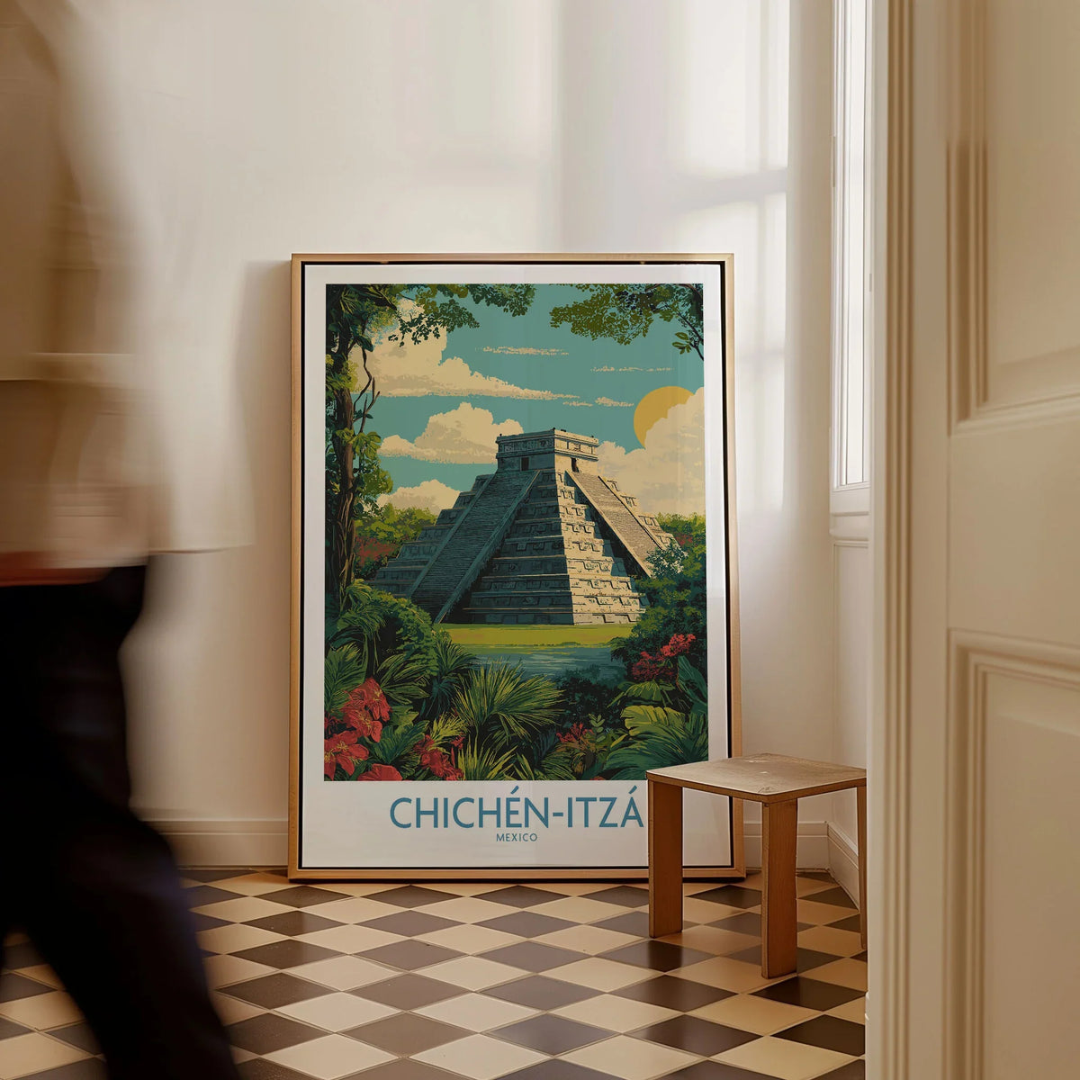 Mexico Chichén Itzá Mayan Pyramid Poster Jungle Ruins Travel Print El Castillo Art as a framed canvas leaning in a hallway with a chequered tiled floor