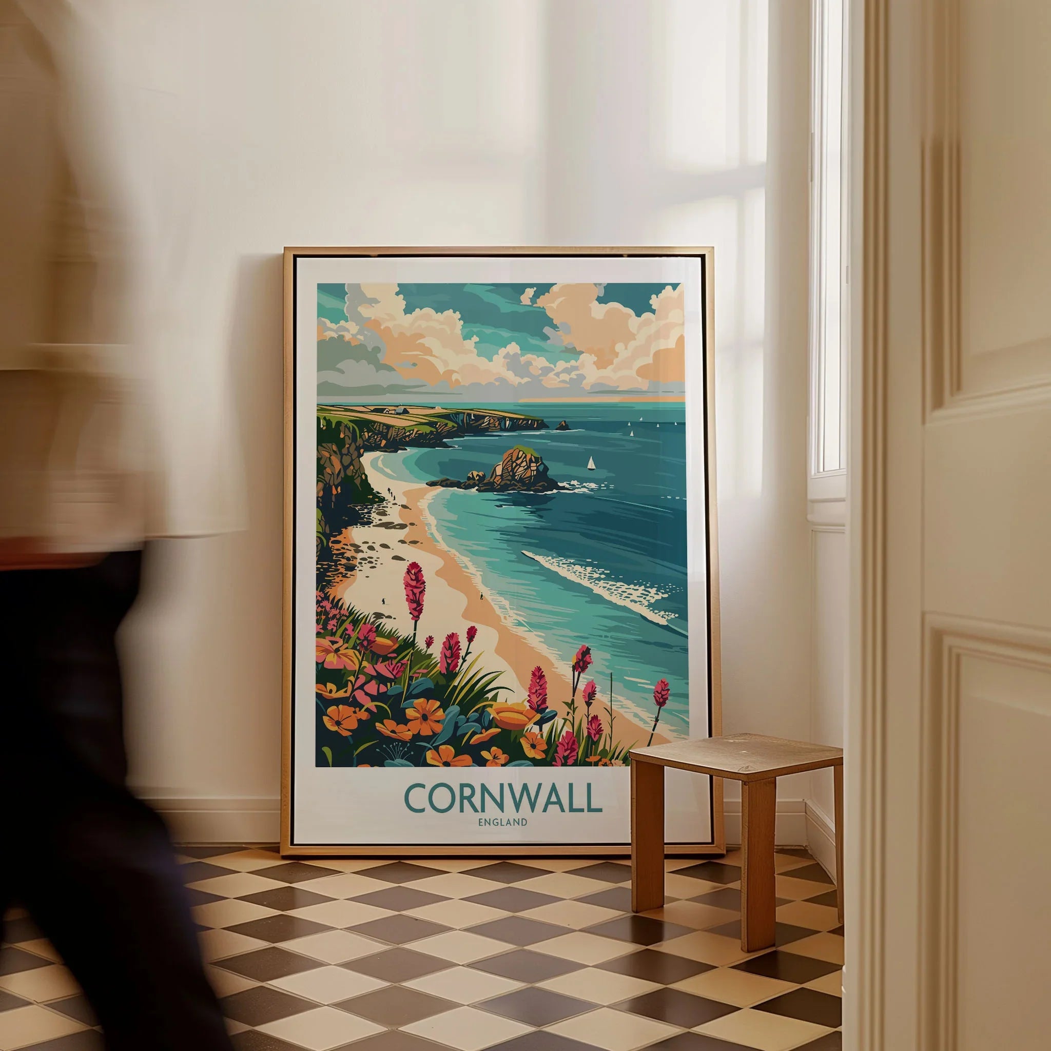 Cornwall Travel Poster - United Kingdom as a framed canvas leaning in a hallway with a chequered tiled floor