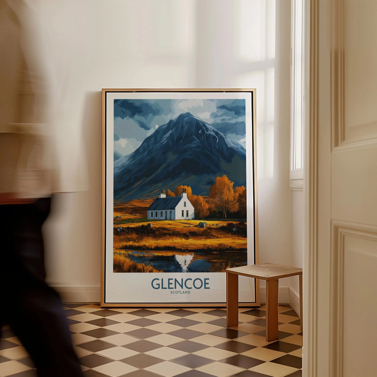 Glencoe Scotland Print as a framed canvas leaning in a hallway with a chequered tiled floor