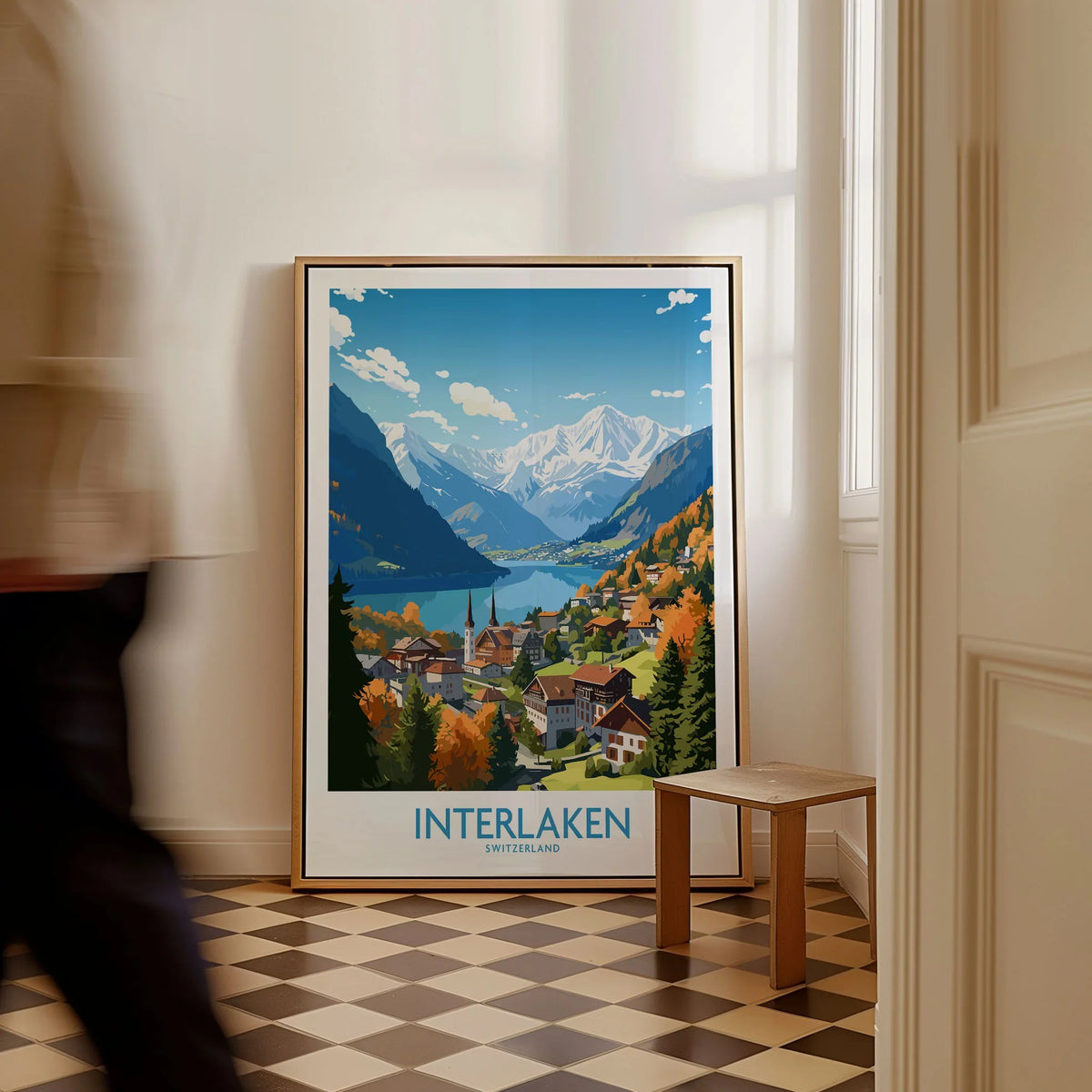 Interlaken Print as a framed canvas leaning in a hallway with a chequered tiled floor