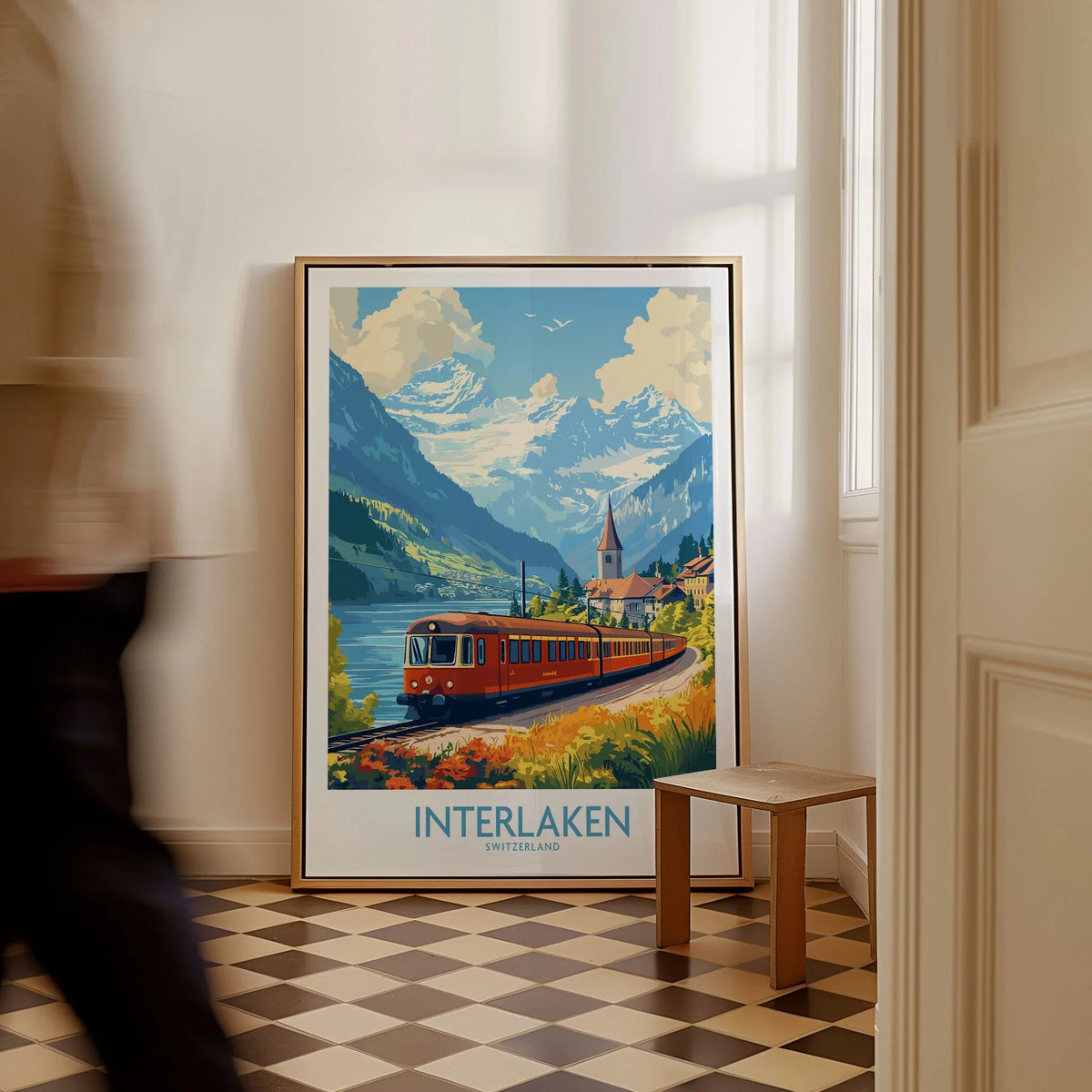 Interlaken Travel Poster as a framed canvas leaning in a hallway with a chequered tiled floor