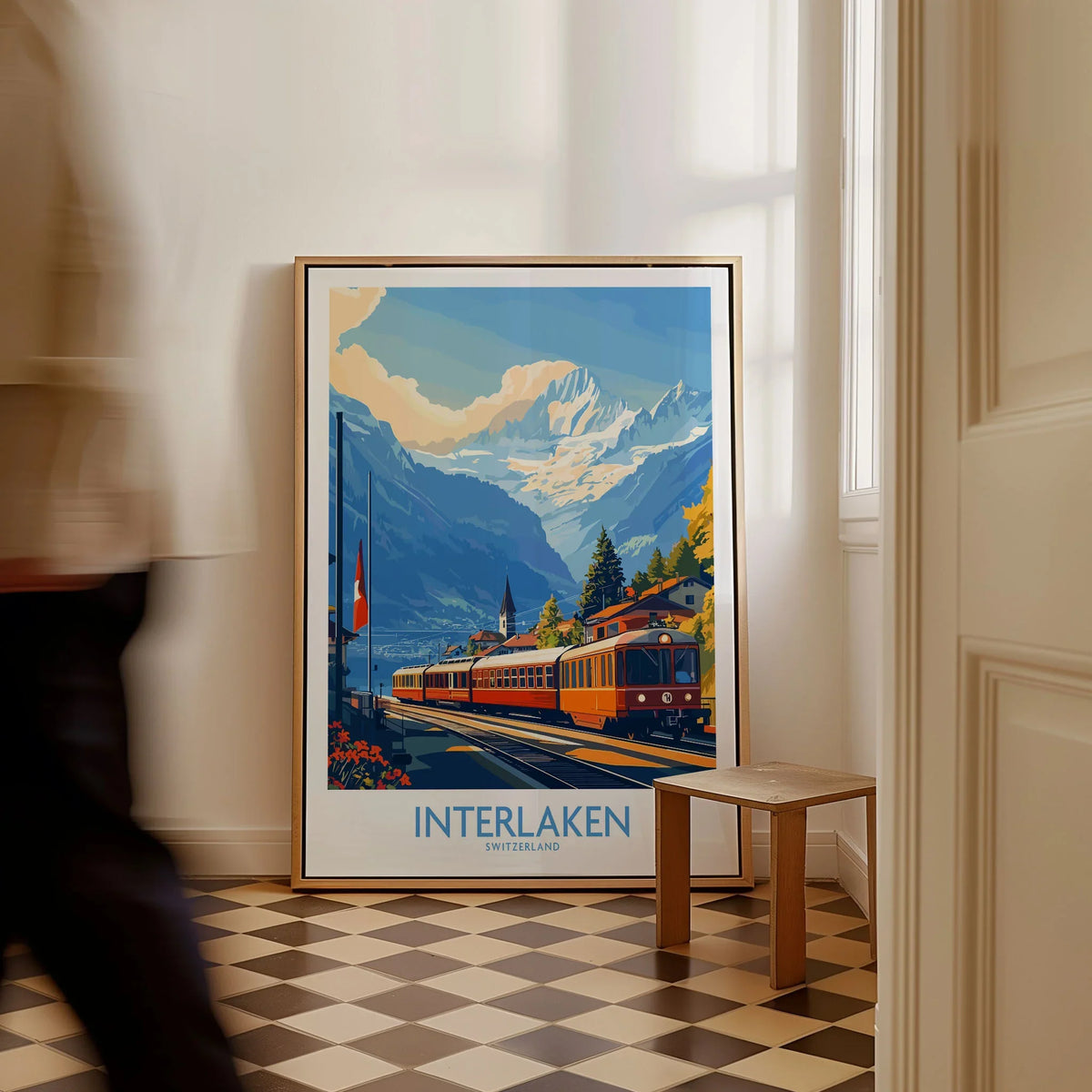 Interlaken Wall Art Print No. 2 as a framed canvas leaning in a hallway with a chequered tiled floor