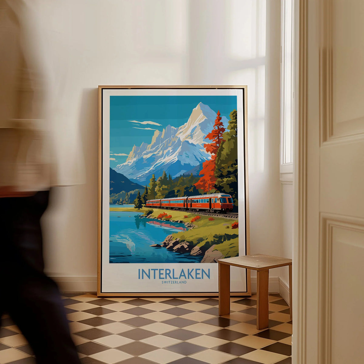 Interlaken Poster Switzerland as a framed canvas leaning in a hallway with a chequered tiled floor