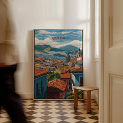 Quito Ecuador Travel Print Rooftop View Poster Cityscape Andes Hills Wall Art Decor as a framed canvas leaning in a hallway with a chequered tiled floor