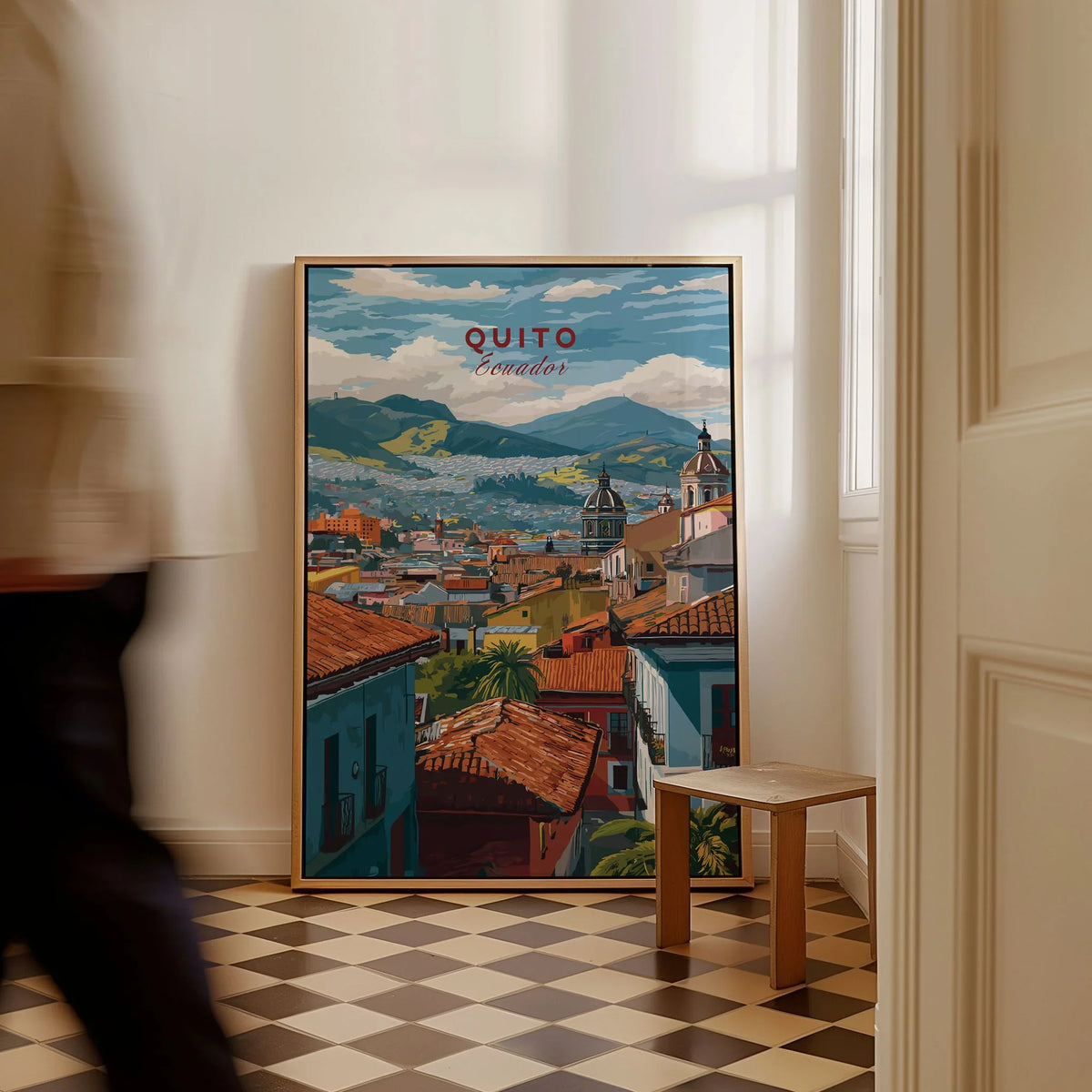 Quito Ecuador Travel Print Rooftop View Poster Cityscape Andes Hills Wall Art Decor as a framed canvas leaning in a hallway with a chequered tiled floor