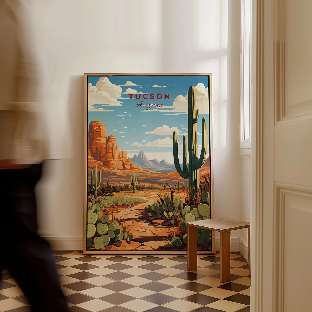 Tucson Arizona Print as a framed canvas leaning in a hallway with a chequered tiled floor