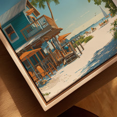 Closeup of framed canvas beach house wall art with natural wood floating frame