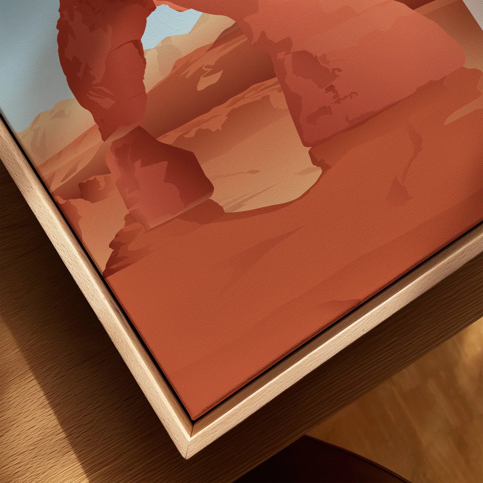Closeup of framed canvas wall art with natural wood floating frame, featuring red rock arch illustration.