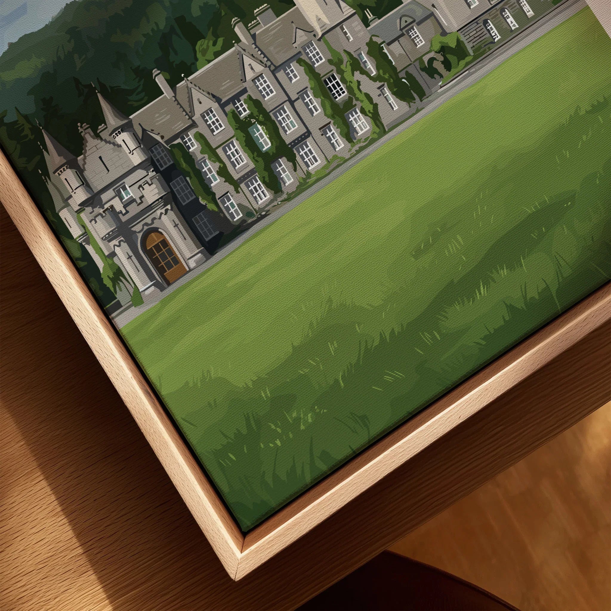 Close-up of framed canvas wall art featuring a historic castle with lush green lawn.