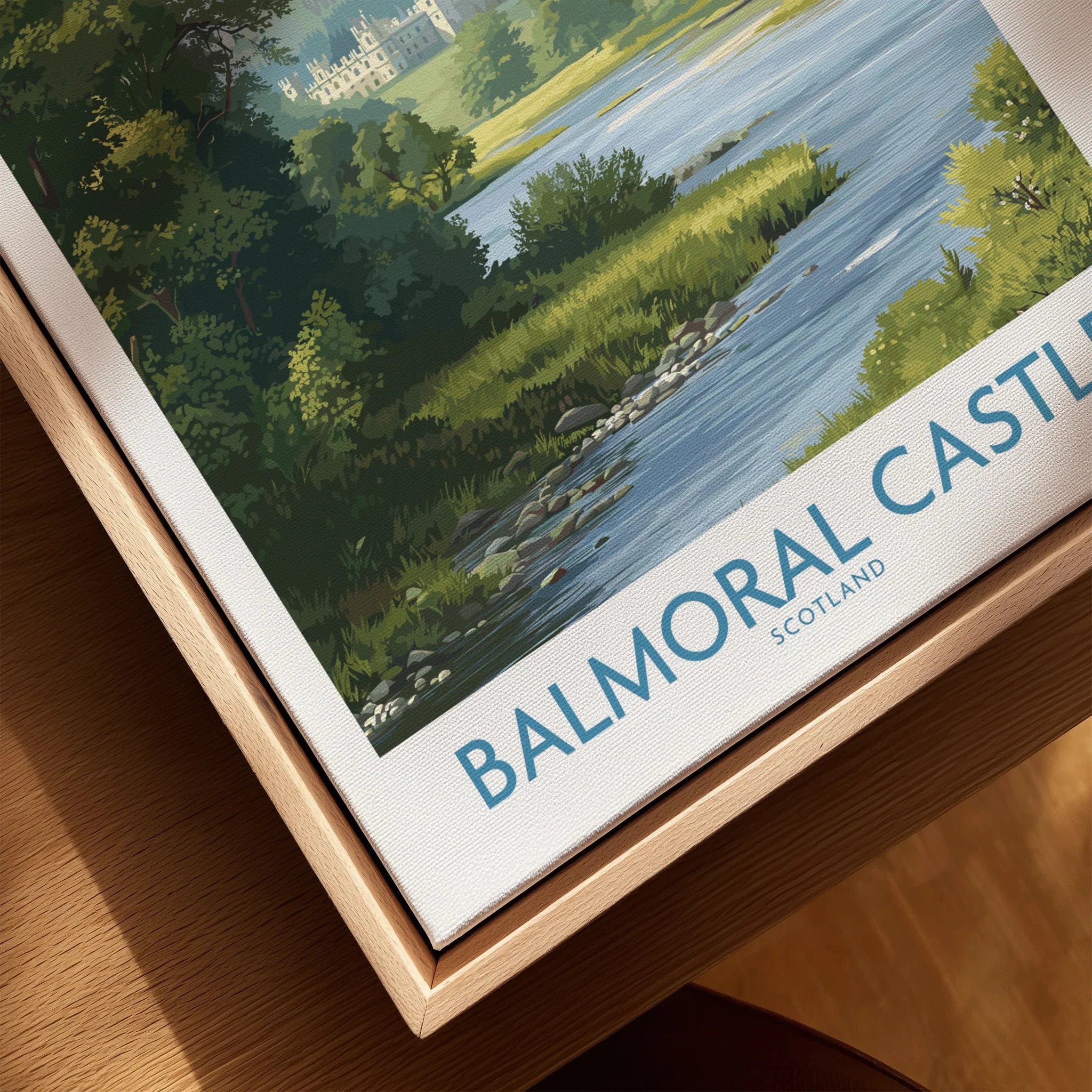 Close-up of Balmoral Castle art print in natural wood floating frame, scenic landscape design