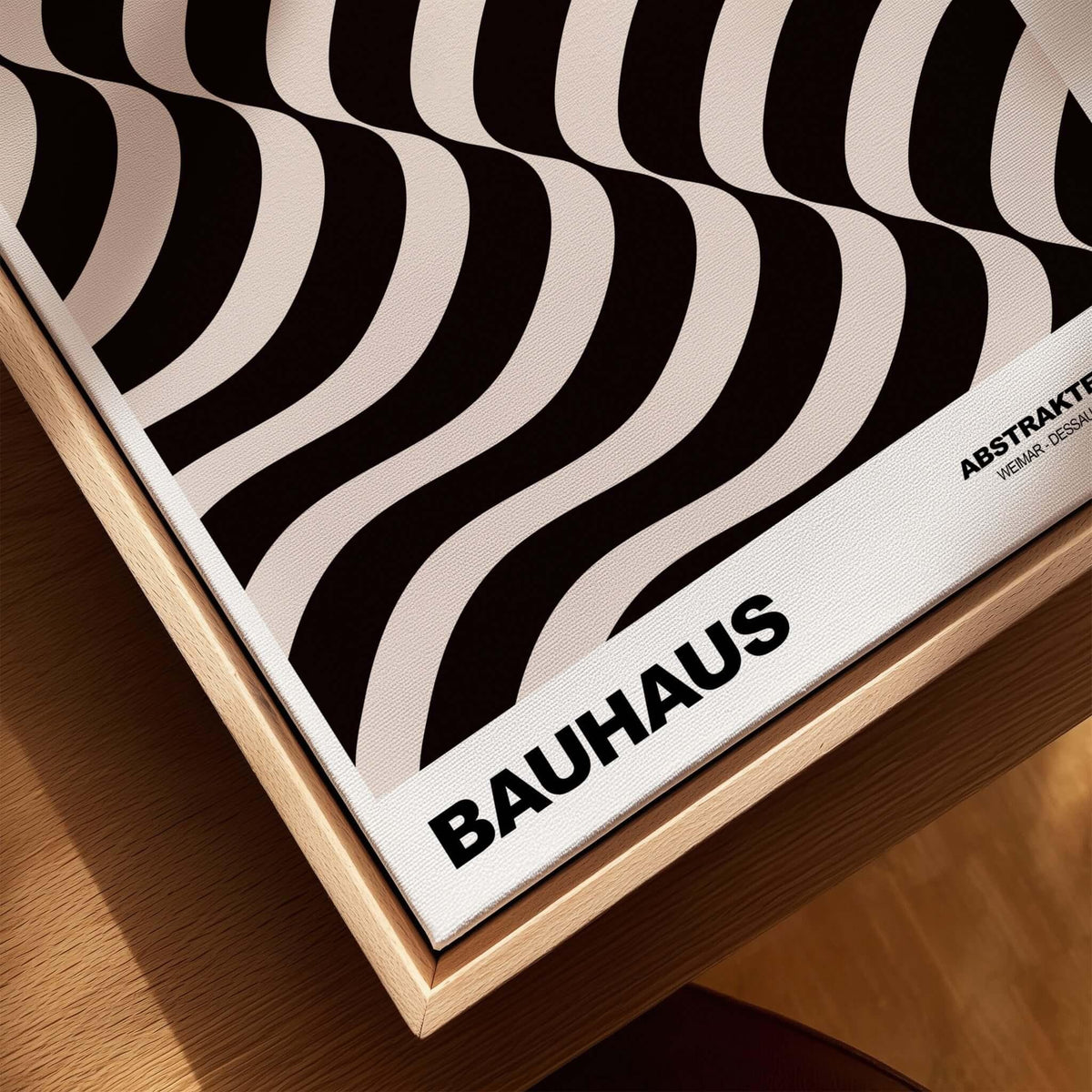 Bauhaus Exhibition Prints - Thick Undulating Waves Poster Black Cream Abstract Art displayed on a wooden frame.