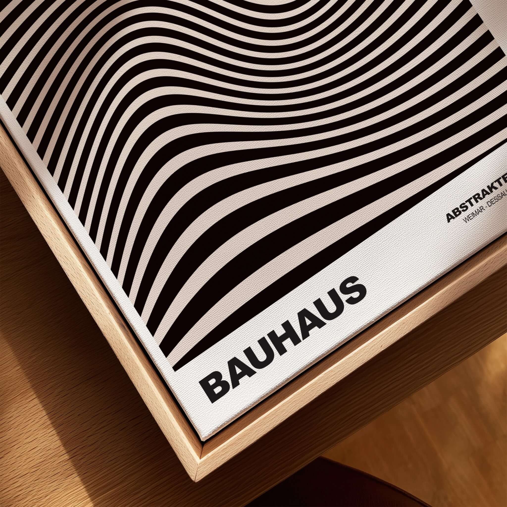 Bauhaus Exhibition Prints -  Optical Wave Lines Art Print Black Cream Abstract showcased on wooden surface with wavy design.