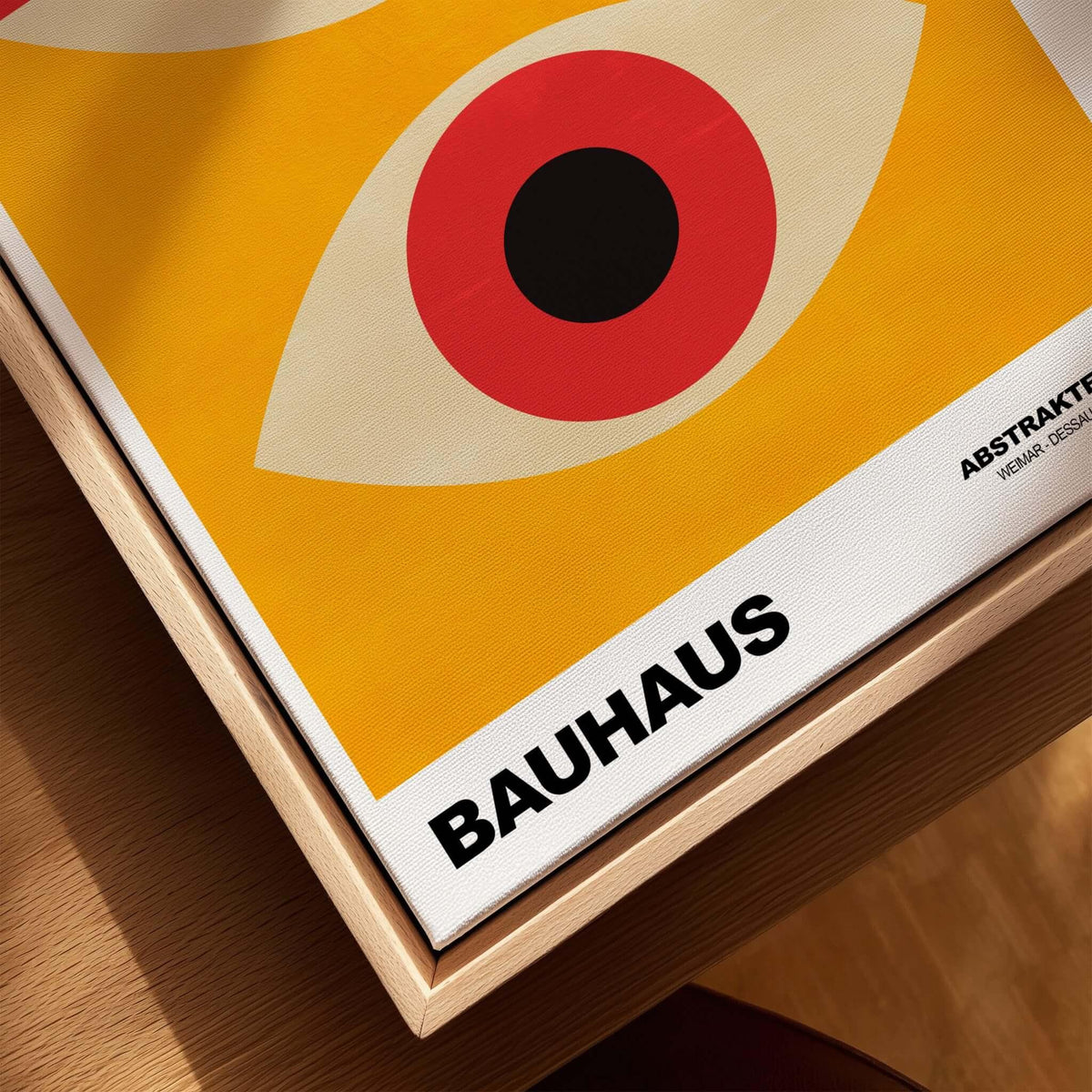 Bauhaus Exhibition Prints - Abstract Eyes Poster Geometric Orange Red Blue Art displayed on a wooden table.