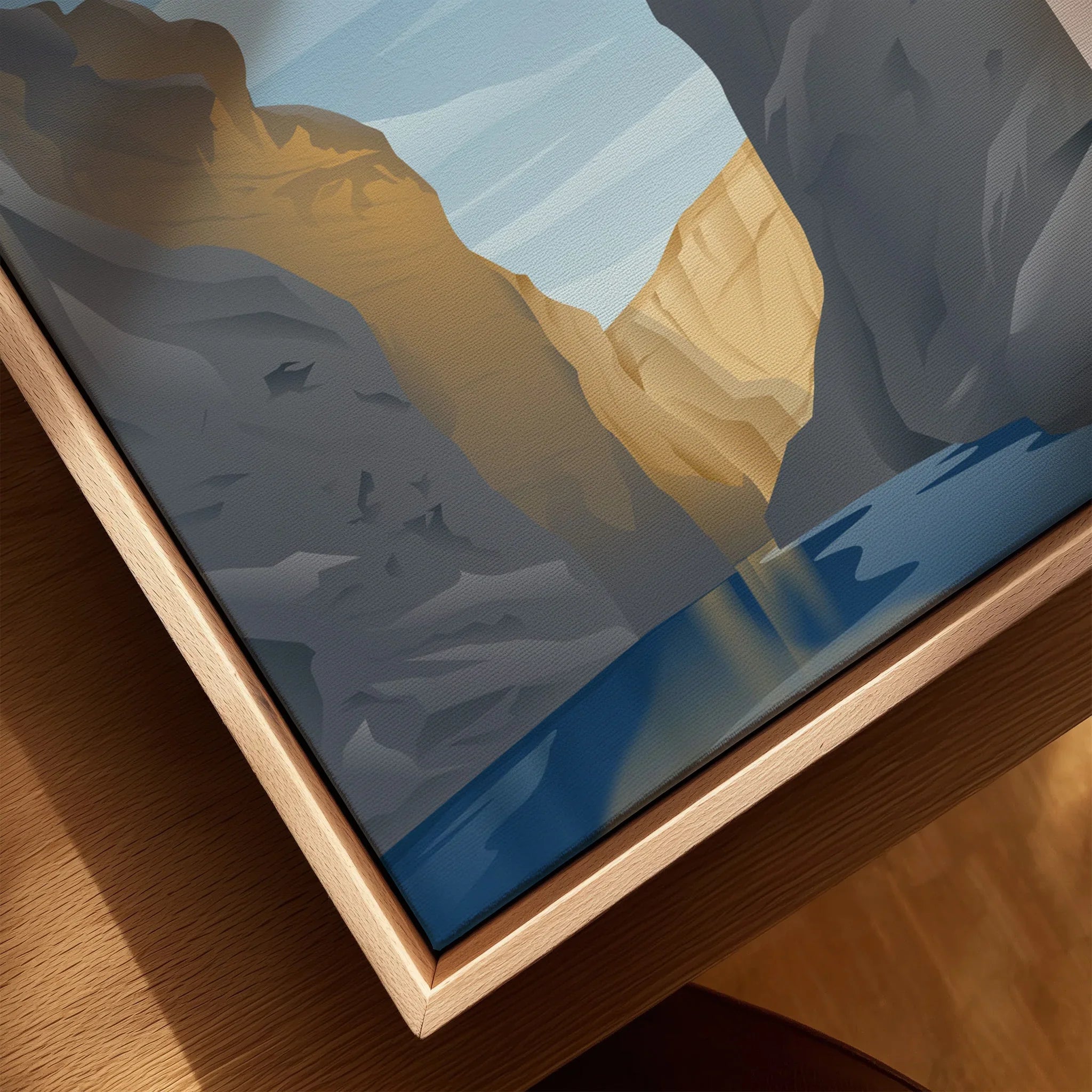 Closeup of framed canvas wall art featuring canyon landscape and river, natural wood frame