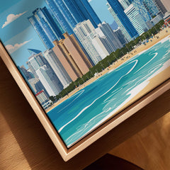 Close-up of a framed canvas print featuring a colorful city skyline and beach illustration.