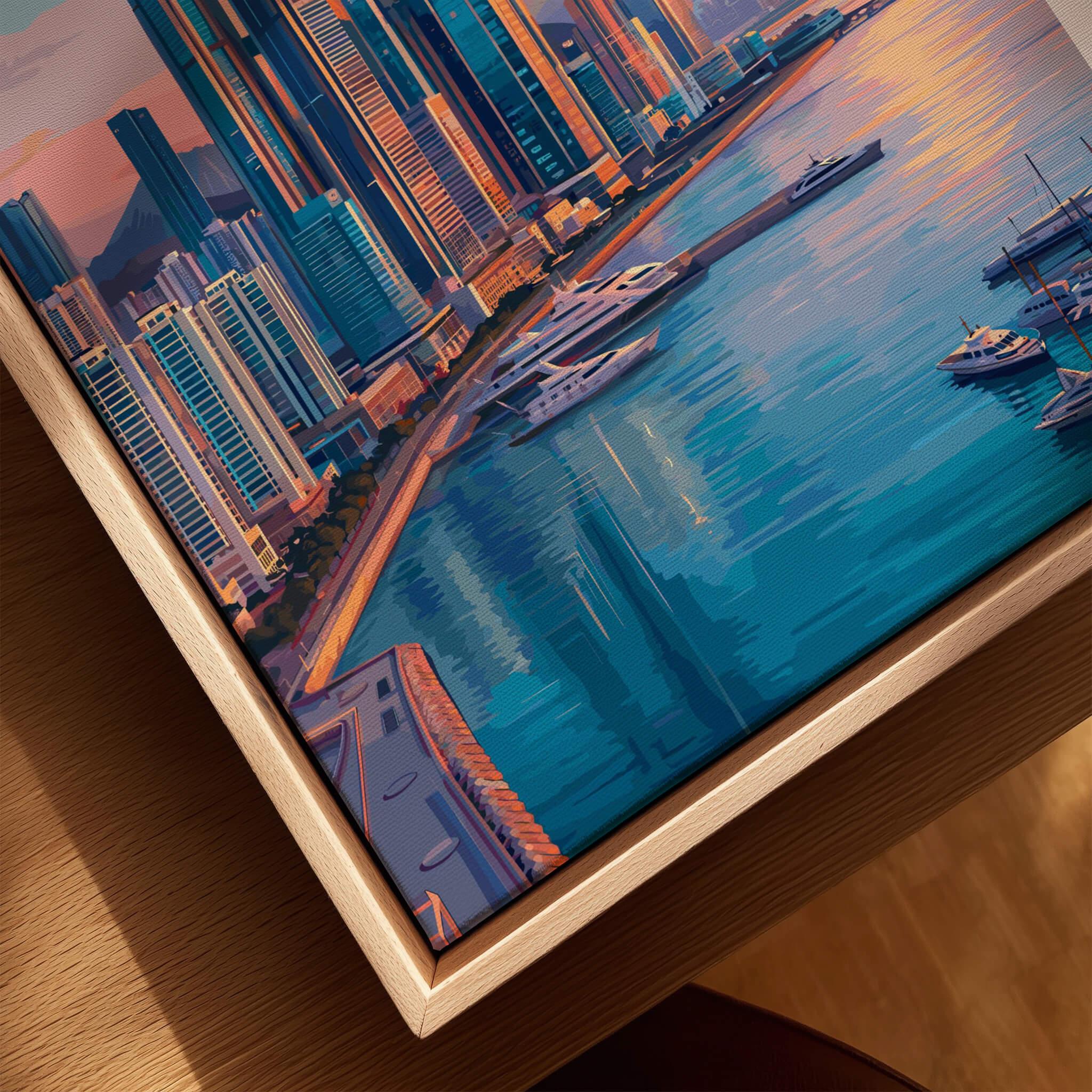 Close-up of framed city skyline wall art with modern buildings, marina, and natural wood frame