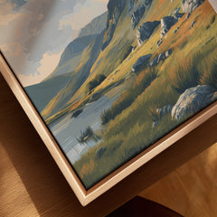 Closeup of framed canvas wall art featuring a mountain landscape and lake in natural wood frame