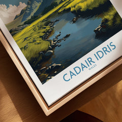 Close-up of framed canvas travel poster for Cadair Idris Wales with a nature landscape.