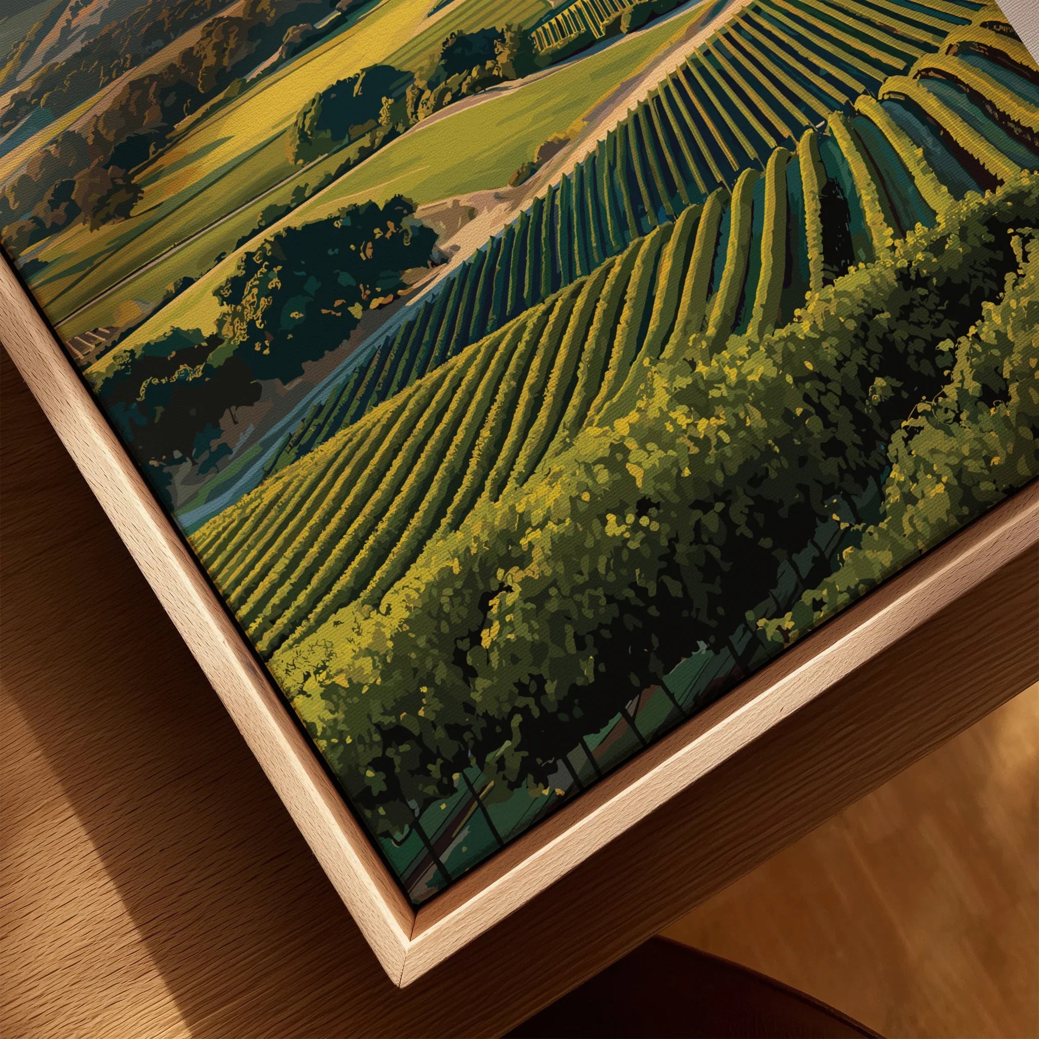Closeup of framed canvas art featuring vineyard hills landscape in a natural wood floating frame.