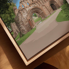 Close-up of framed canvas wall art featuring a historic stone archway with natural wood frame